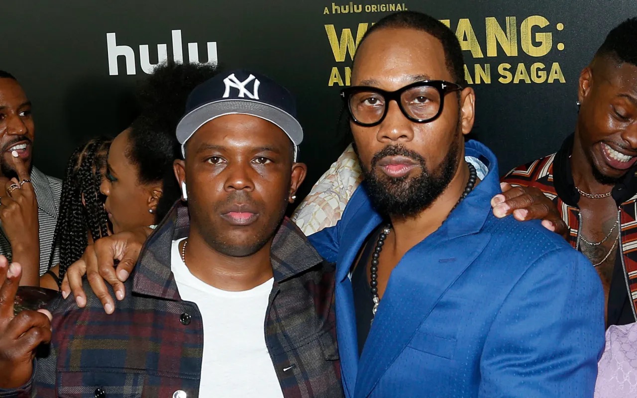 Power and Rza, with Rza's arm om Power's shoulders